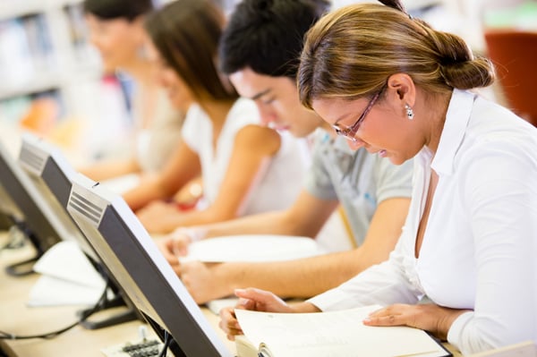 Group of students studying in a computer room